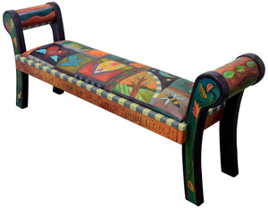 Beautiful warm colored bench with a cozy crazy quilt motif. Side view