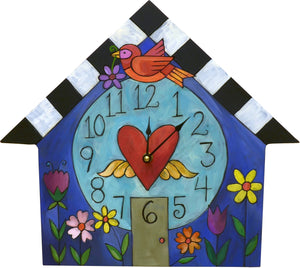 "A Little Birdie Told Me" House Clock – A bird is perched on a home with flower beds out front front view