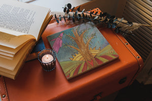 Sun Marble Trivet – Tumbled marble trivet with a Sticks Tree of Life in the foreground of a sunny landscape scene main view