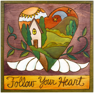 Sticks handmade wall plaque with "Follow your heart" quote and heart with wings and home imagery
