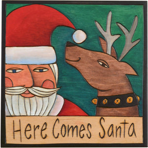 Sticks handmade wall plaque with "Here Comes Santa" quote with Santa and reindeer imagery
