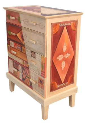 Tall Dresser –  Beautiful patchwork themed dresser done in warm tones and whitewash accents angled view