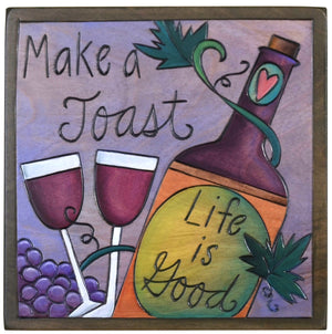 Sticks handmade wall plaque with "Make a Toast, Life is Good" quote and red wine imagery