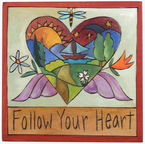 Sticks handmade wall plaque with "Follow your heart" quote and heart with wings imagery