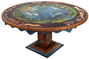 72" Round Dining Table –  "Home is Where the Heart is" round dining table with cats and dogs chasing one another around a beautiful landscape motif