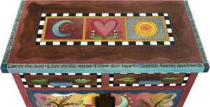 Small Buffet –  "Live by the Sun/Love by the Moon" small buffet with sun and moon in a pink sky over a green horizon motif