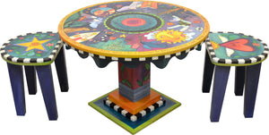 Adorable imagination themed kid's table with cute coordinating heart and star short stools, side view including stools