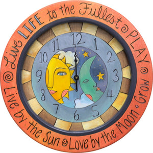 14" Round Wall Clock –  "Live life to the fullest, play" celestial sun and moon clock motif