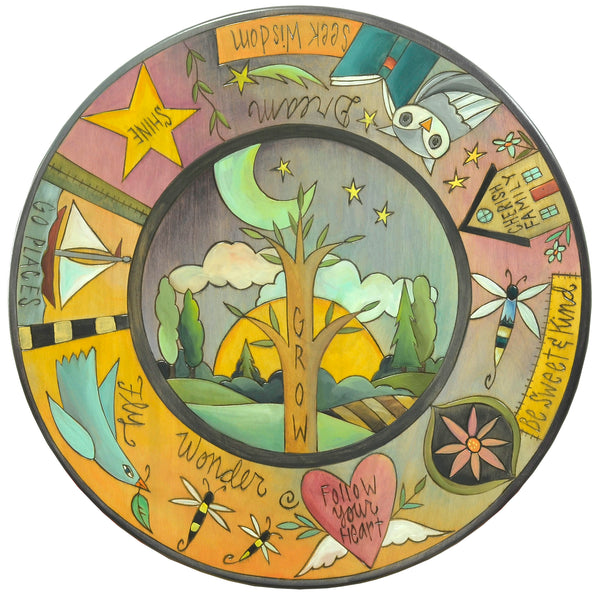 A "grow" tree of life is surrounded by floating icons and heartwarming phrases on this tabletop