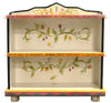 Fun crazy quilt bookcase design featuring polka-dots and floral vine accents