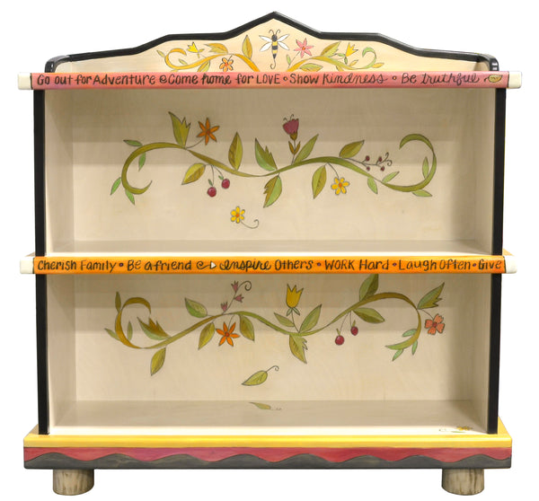 Fun crazy quilt bookcase design featuring polka-dots and floral vine accents