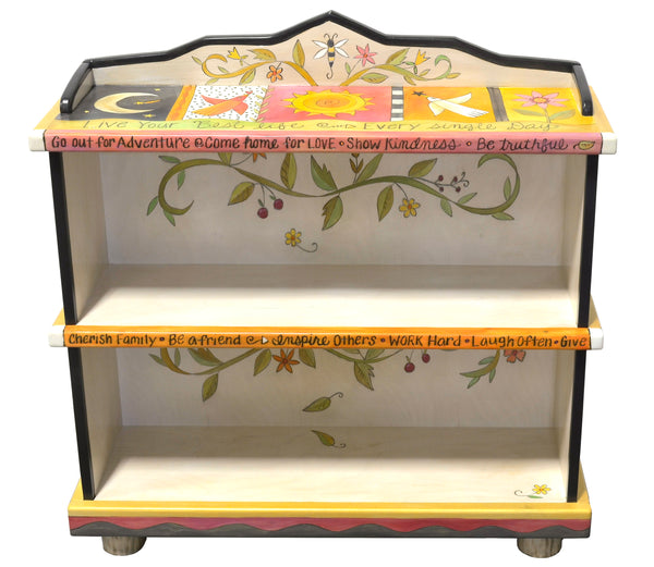 Fun crazy quilt bookcase design featuring polka-dots and floral vine accents