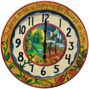 24" Round Wall Clock – Colorful clock in a four seasons design with a landscape in the center and coordinating vine resting on the bottom edge