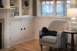 "Time to Shine" Square Clock – Celestial clock theme with roman numerals and inspirational phrases displayed on built-in bookshelf behind lounging dog