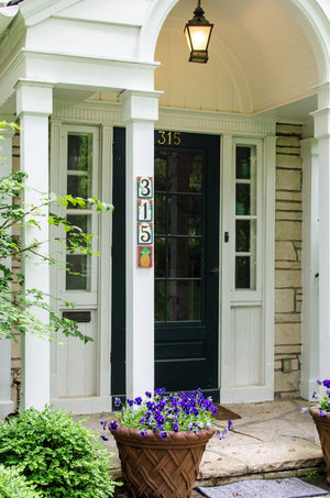 Example of "315" Sincerely, Sticks house number plaque at a front door with pineapple icon
