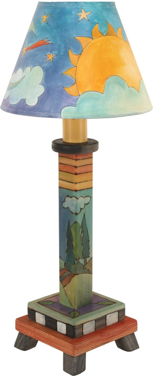 Milled Candlestick Lamp –  The cute landscape base and sky shade design on this lamp makes it perfect for a nightstand
