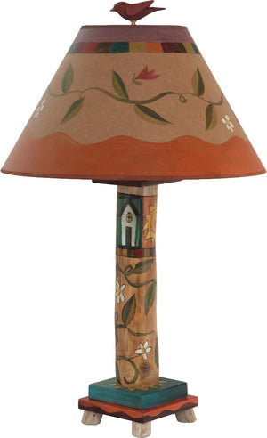 Log Table Lamp –  Elegant and neutral color palette table lamp with vine motifs and symbolic block icons