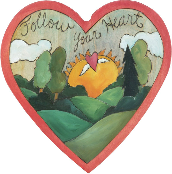 Heart Shaped Plaque –  "Follow Your Heart" heart shaped plaque with rising sun landscape and heart with wings