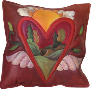 Leather Pillow –  Heart with wings pillow framing a rolling landscape