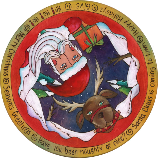 20" Lazy Susan – Santa and a reindeer popping out of a winter landscape in a vibrant jewel palette