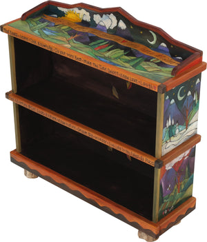 Short Bookcase –  "Go Out for Adventure/Come Home for Love" bookcase with sun and moon over snow-capped mountains motif