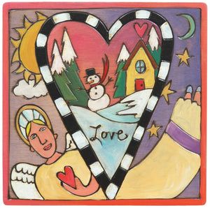 Sticks handmade wall plaque with "Love" quote, an angel, and a snowy landscape within a heart shape