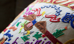 North Dakota Hand-Embroidered Pillow -  From the Badlands to the Prairie, Lewis & Clarke and the Rough Riders, this original design celebrates the State of North Dakota.
