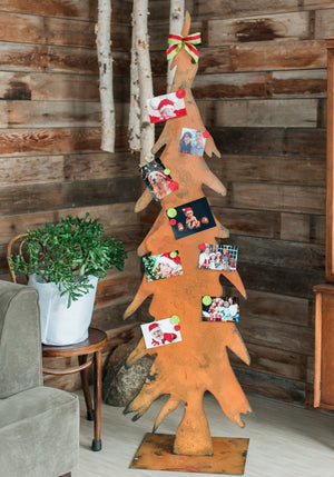 Tall Pencil Tree Sculpture – These showstopper tree sculptures would look perfect alone or grouped at your front door, within your landscaping, near the fireplace, or as a Christmas card display during the holidays - so versatile! displaying family Christmas photos