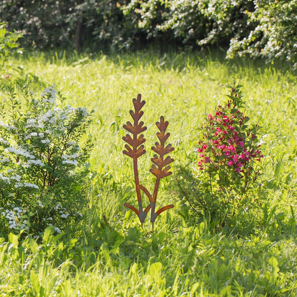 Lavender metal garden stake in grass