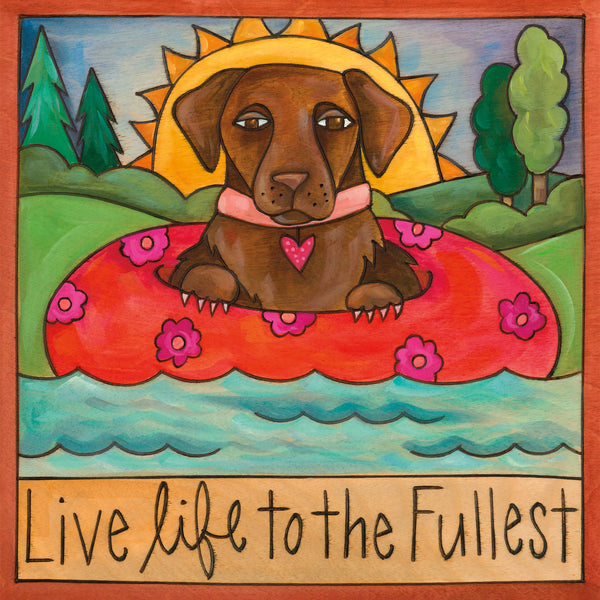 Illustration of a dog in an inner tube with flowers, surrounded by nature and a sun, with 'Live life to the Fullest' text at the bottom.