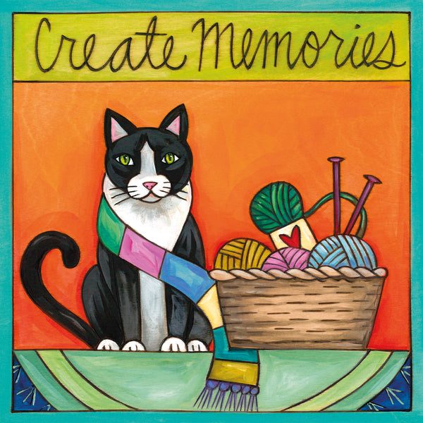Tuxedo cat wall art with yarn and knitting needles, 'Create Memories' text on colorful background