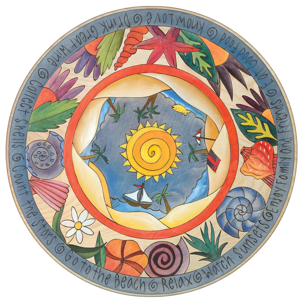 Decorative beach themed lazy susan with shells and a nautical center