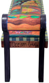 Beautiful warm colored bench with a cozy crazy quilt motif. Other arm view