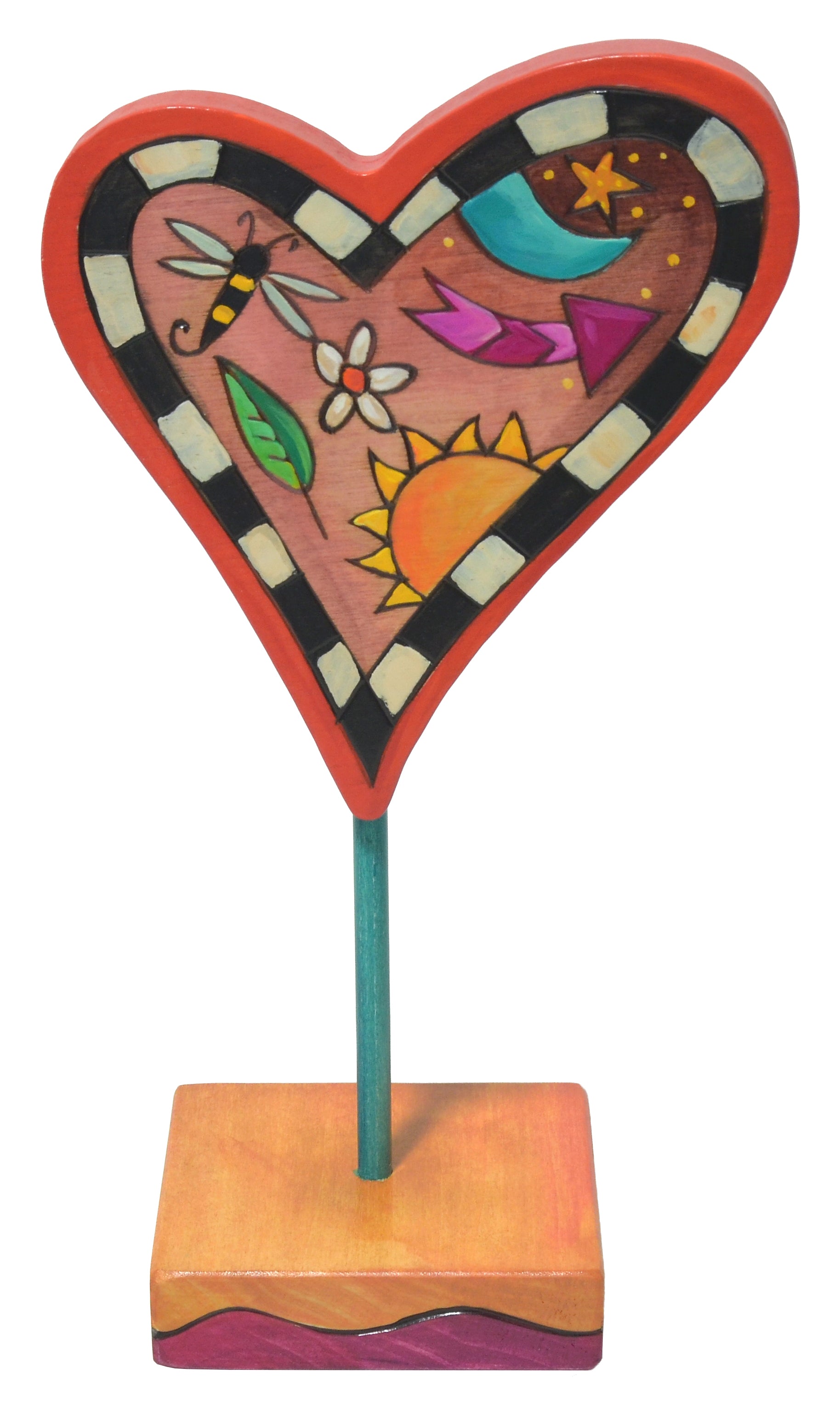 Decorative heart-shaped object with colorful designs on a stand against a white background