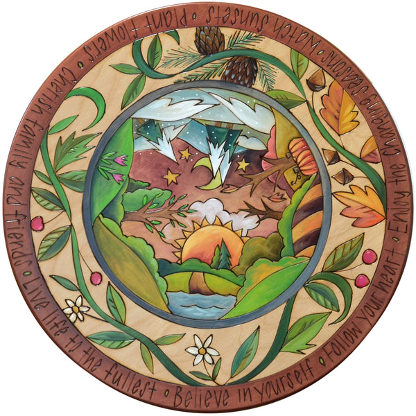 Decorative lazy susan with nature-themed design and text around the edge.