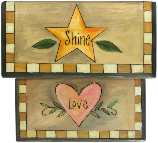 Top view of handmade step stool, with a star and heart on each step