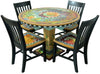 Hand painted four seasons 42" circular table with four black matching chairs against a white background
