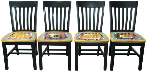 Four black wooden chairs with sun and moon artwork on the seats, against a white background.