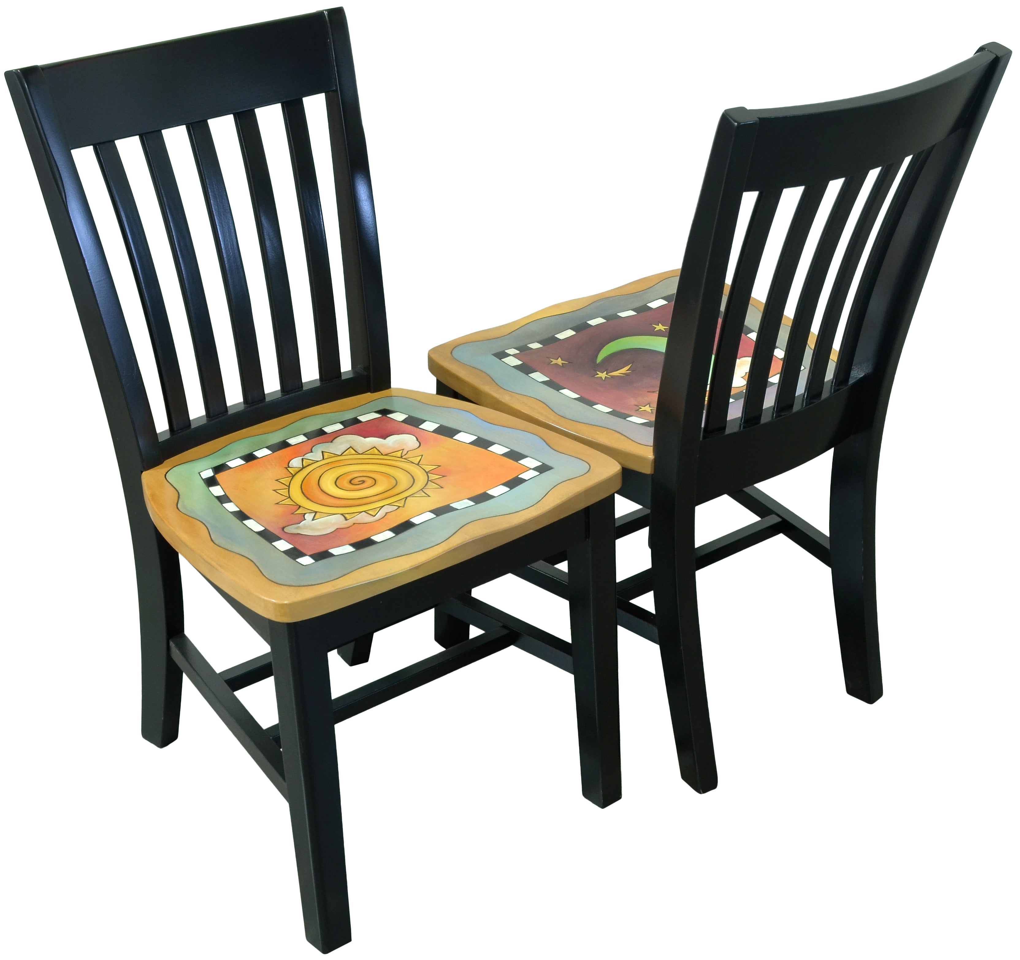 Two black chairs with sun and moon artwork on the seats against a white background