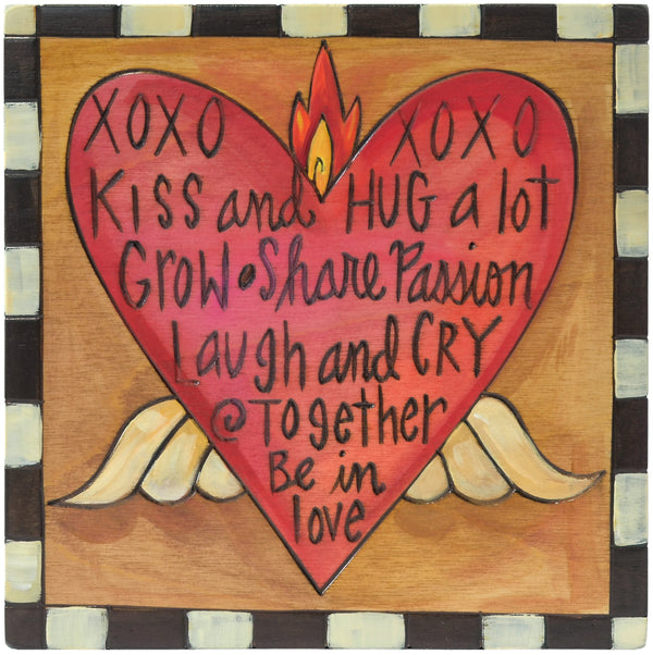 Decorative plaque with a heart and romantic phrases on a checkered background
