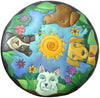 Top view of hand painted circle leather ottoman featuring four dogs heads with a nature motif