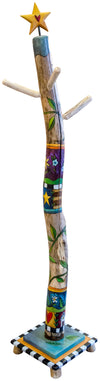 Decorative log coat tree with colorful patterns, stars, and flowers on a white background