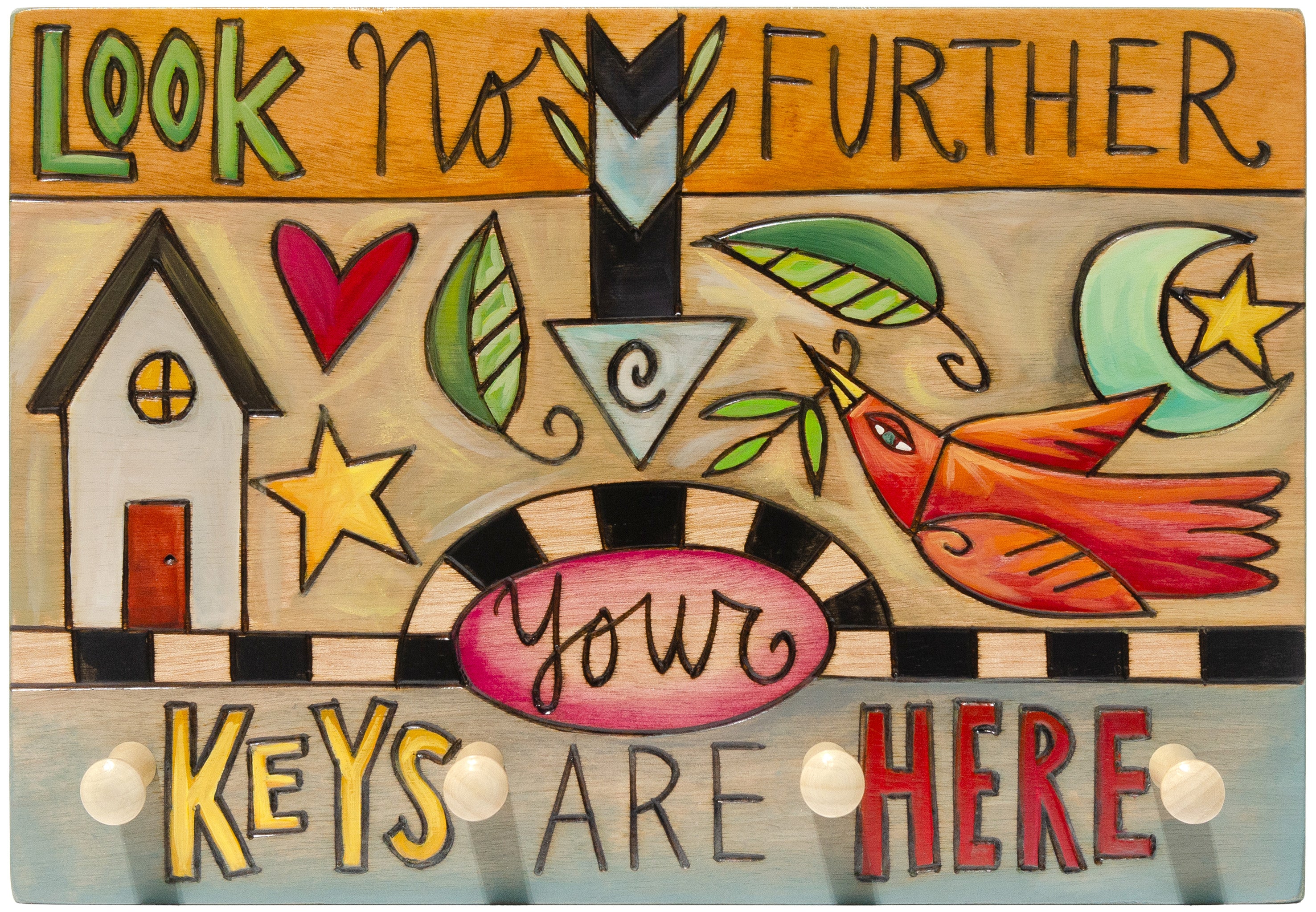 Decorative key holder with colorful text and symbols on a wooden background