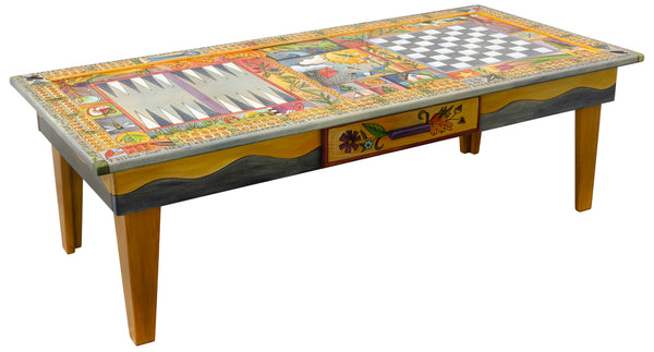 A highly detailed, colorful folk art style game table. The game table is decorated with intricate illustrations of autumn landscapes, including pumpkins, corn, a sunset, a bird, and a small house, framed by a decorative border.