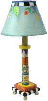 Colorful children's lamp with a decorated base and lampshade on a white background