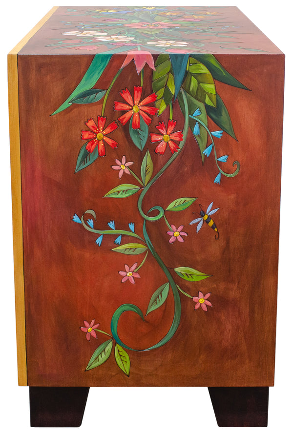 Side of media buffet with floral designs on a white background