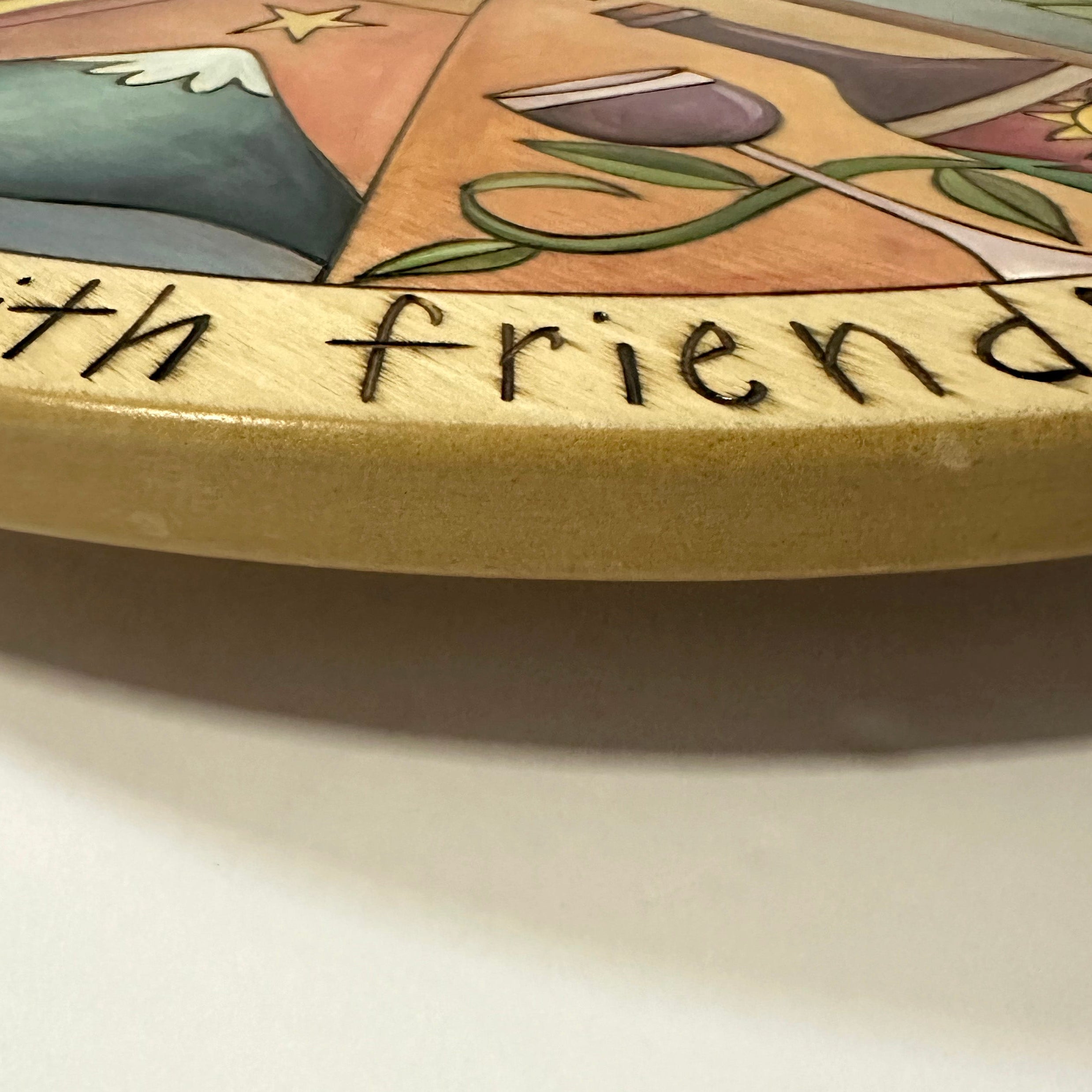 Closeup picture of repairs made on the edge of a lazy susan