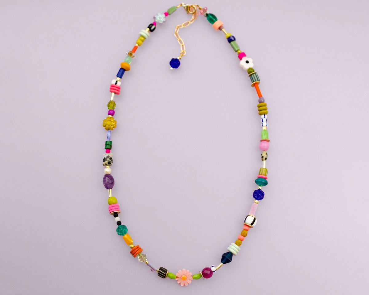 This handmade necklace features a vibrant assortment of beads, including natural gemstones