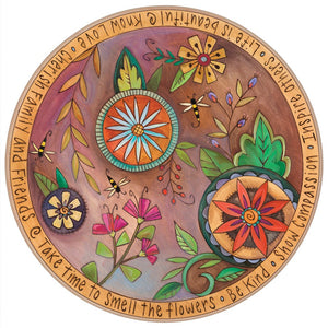 Brightly colored contemporary floral design on a decorative wood lazy susan