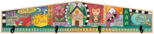 Patchwork design of positive phrases and images on a wood coat rack to hold your belongings